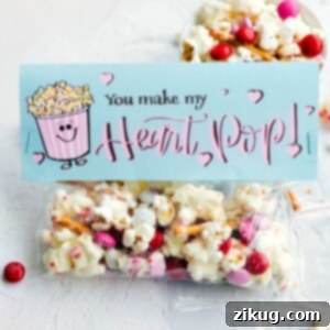 Delicious White Chocolate Popcorn Mix, adorned with Valentine's Day sprinkles and M&M's