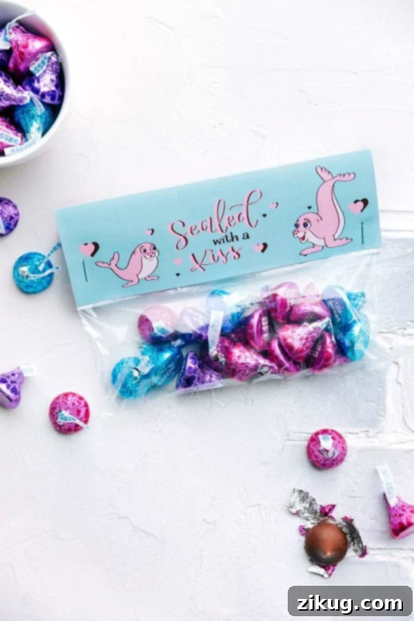 Valentine's Day Gifting Made Simple 7 Festive 'Sealed With A Kiss' Hershey's Kisses gift bag with a romantic lip-print printable topper
