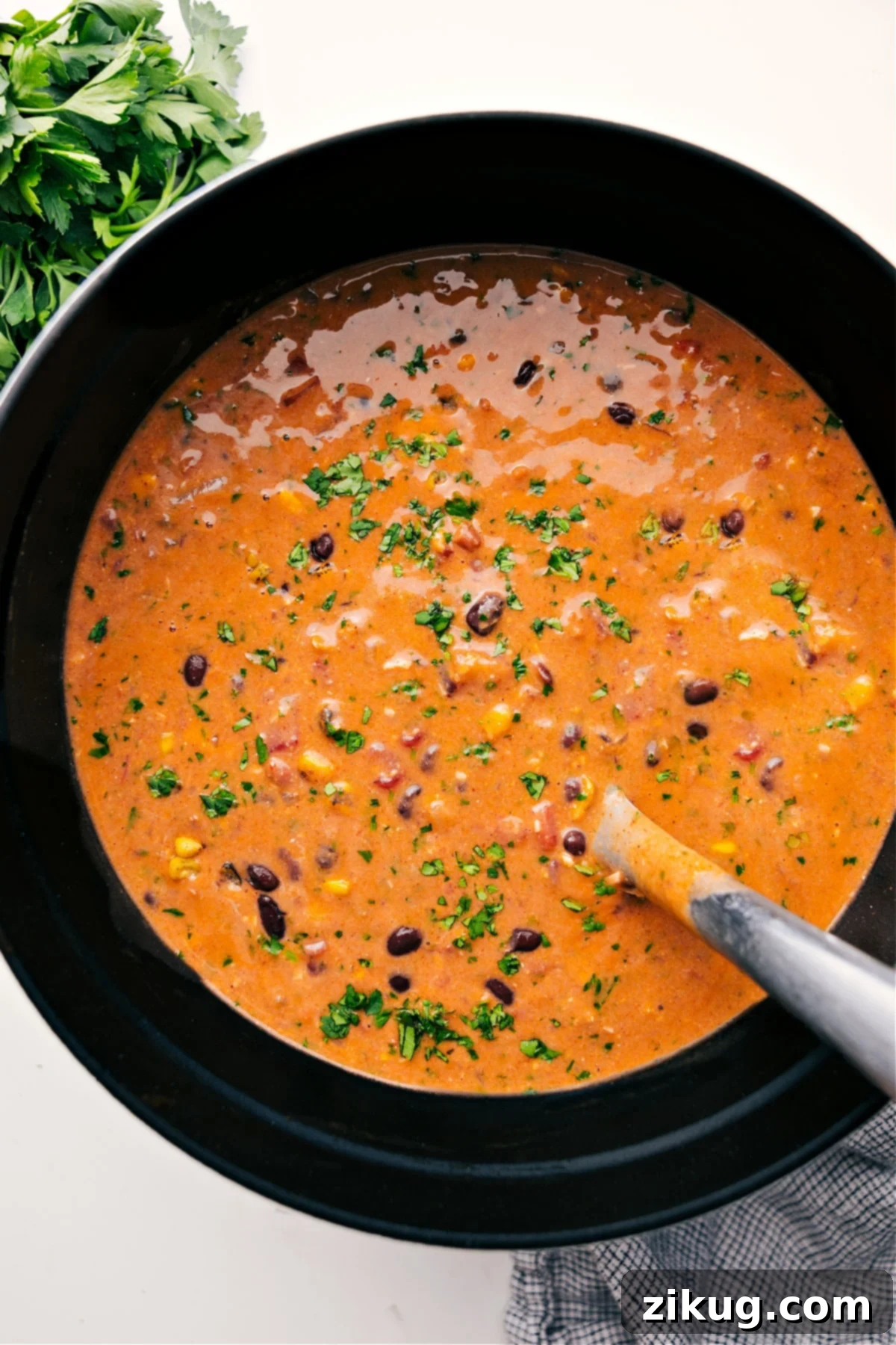 Delicious One-Pot Chicken Tortilla Soup Recipe for Weeknights A large pot filled with a steaming, rich Chicken Tortilla Soup, garnished with fresh cilantro and lime wedges, ready to be served family-style.