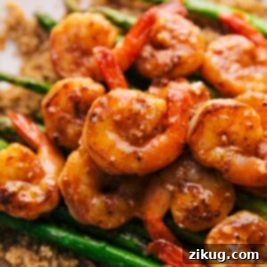 A vibrant bowl of Lemon Garlic Shrimp, perfectly cooked and glistening with sauce.