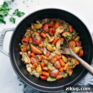 Rustic Cabbage Sausage and Potato Skillet 8 Finished One Pot Cabbage, Potatoes, and Sausage in a serving bowl, garnished with fresh parsley.