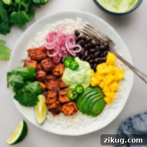 Zesty Mojo Salmon Bowls 2 Mojo Salmon Bowls with all the toppings and dressing ready to be enjoyed.