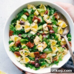 A bowl of Mediterranean Pasta Salad with fresh ingredients.
