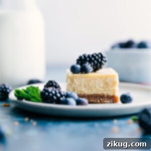 Close-up of a vanilla cheesecake bar slice on a plate with berries