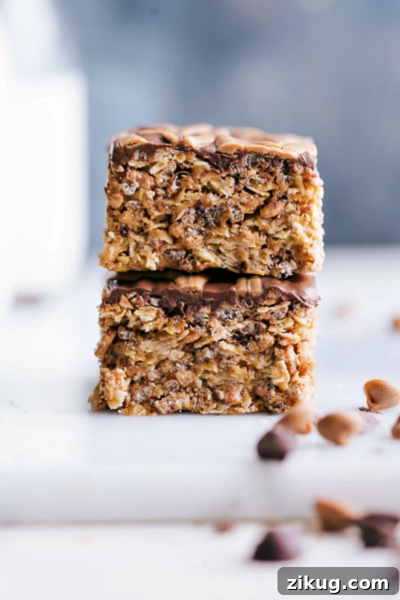 Delicious No-Bake Peanut Butter Chocolate Cereal Bars: A crunchy, sweet, and filling snack or breakfast treat. Two homemade no-bake peanut butter chocolate cereal bars stacked on a rustic surface, ready to be enjoyed as a sweet, crunchy snack.