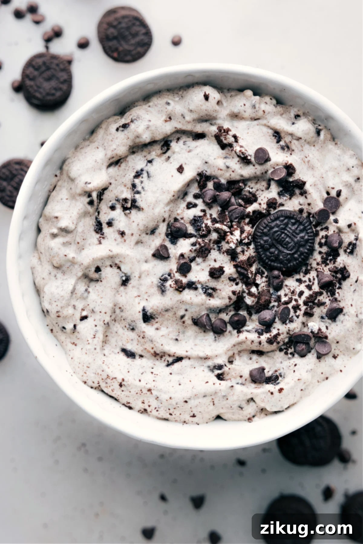 Oreo Fluff in a bowl, showcasing its creamy texture and visible cookie chunks.