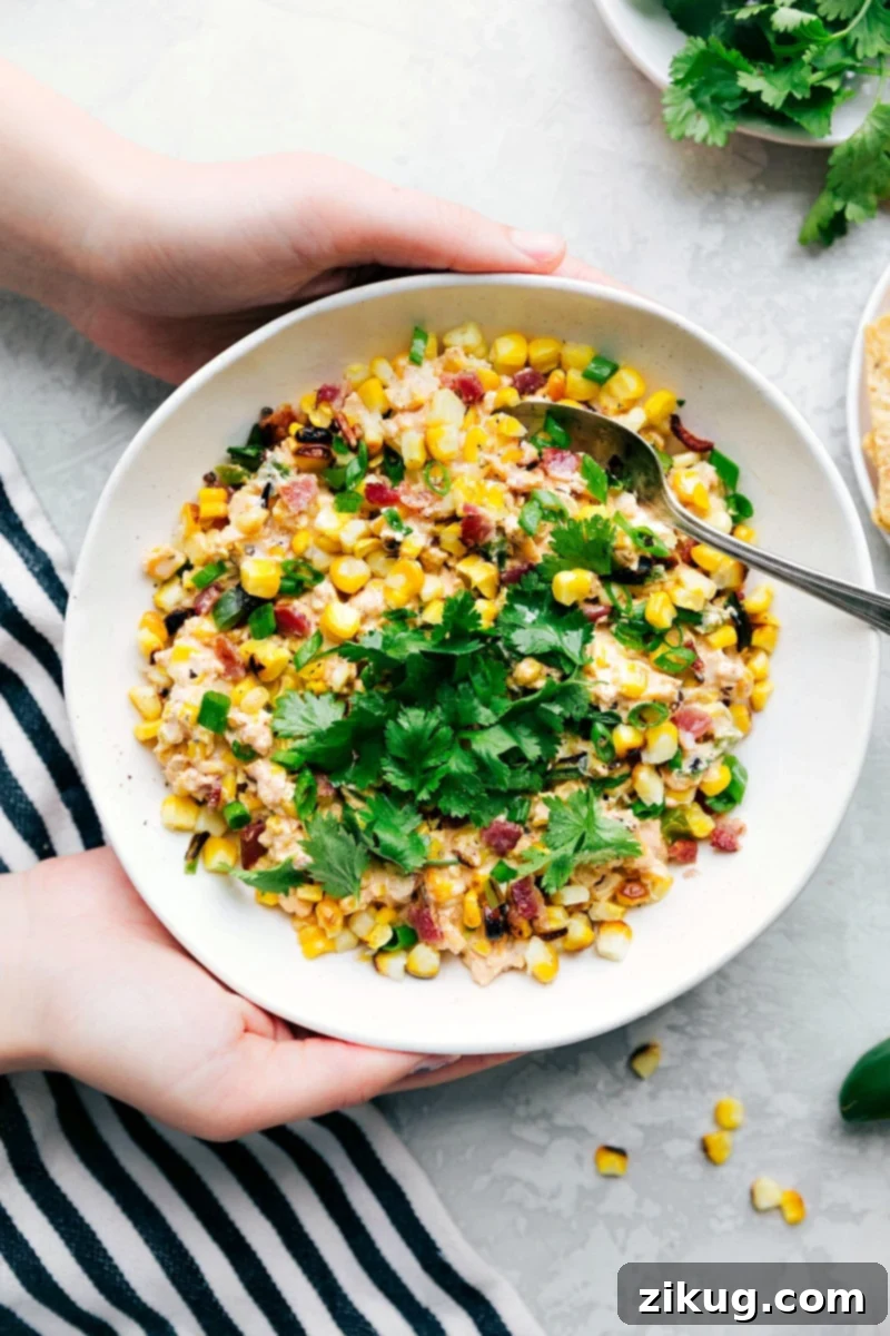 Creamy corn salad, rich and packed full of flavor, ready to be enjoyed as a delightful side dish.