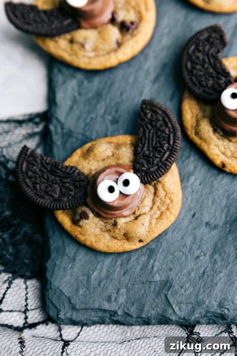 These delicious Halloween cookies only need 4 ingredients! Halloween cookies decorated to look like bats with Rolo bodies and Oreo wings.