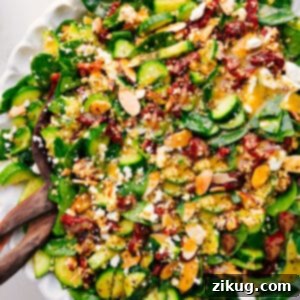 A close-up of the delicious Couscous Mediterranean Salad in a white bowl.