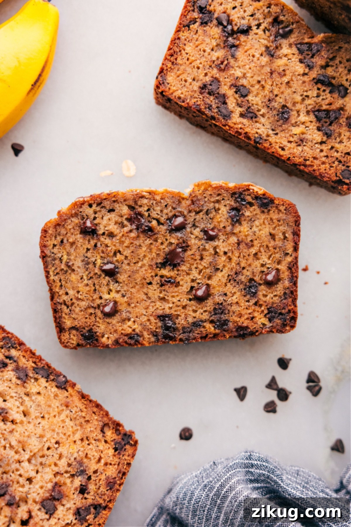 Delicious and Warm Healthy Banana Bread Slices with Chocolate Chips Slices of warm, inviting Healthy Banana Bread with chocolate chips visible, ready to be enjoyed.