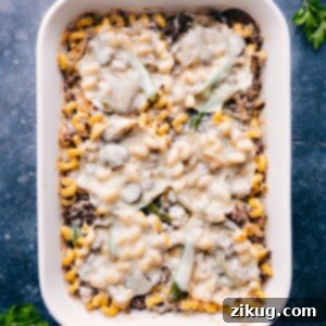 Creamy Philly Cheesesteak Pasta 3 A close-up shot of the finished Philly Cheesesteak Pasta bake with melted cheese and fresh parsley, ready to be served.