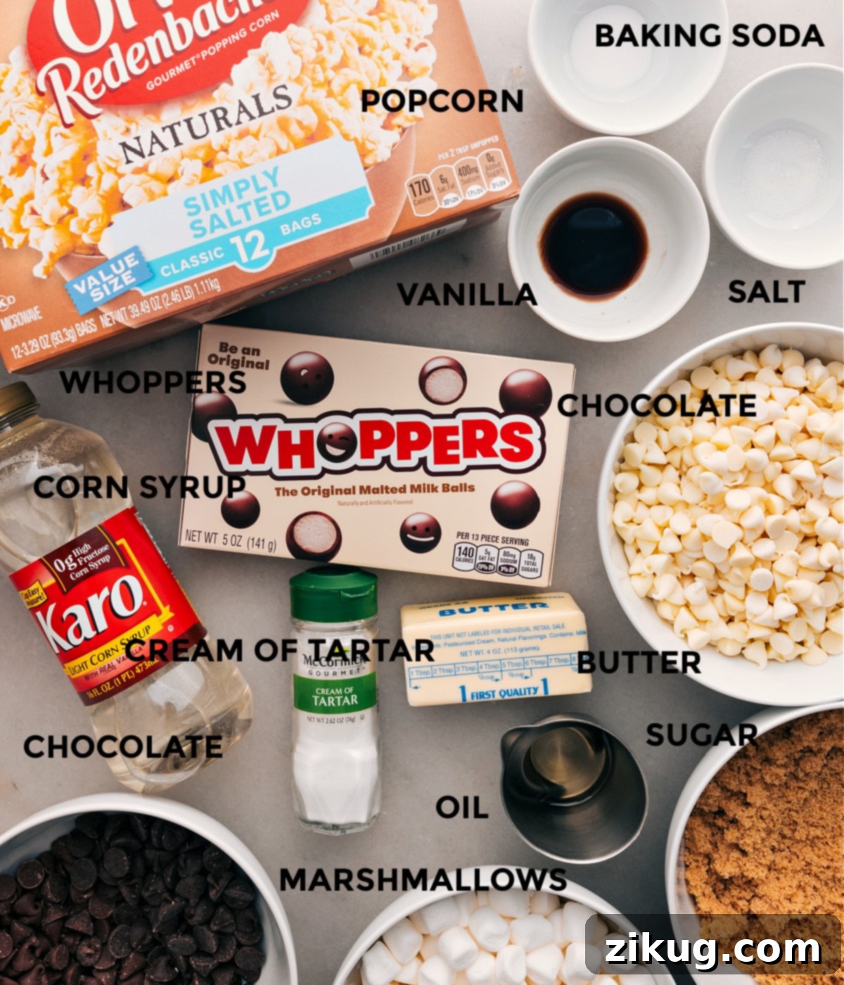 Key Ingredients For Gourmet Chocolate Popcorn All the ingredients for gourmet chocolate popcorn are laid out: baking soda, salt, vanilla extract, popcorn kernels, Whoppers, various chocolate chips, cream of tartar, sugar, corn syrup, and butter.