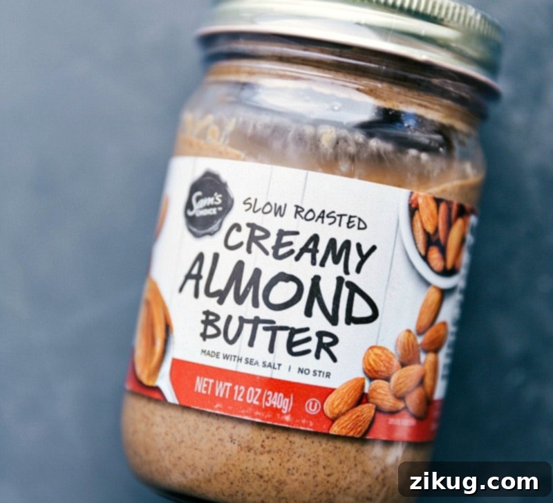 Wholesome Caramel Drizzle 4 Close-up view of creamy, slow-roasted, and lightly salted almond butter, highlighting its smooth texture and rich color – a foundational ingredient for this healthy caramel sauce.