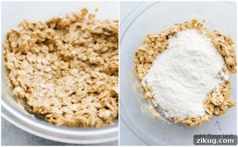 Process shot showing wet ingredients perfectly blended, with flour being added to the mixture for oatmeal chocolate chip cookies