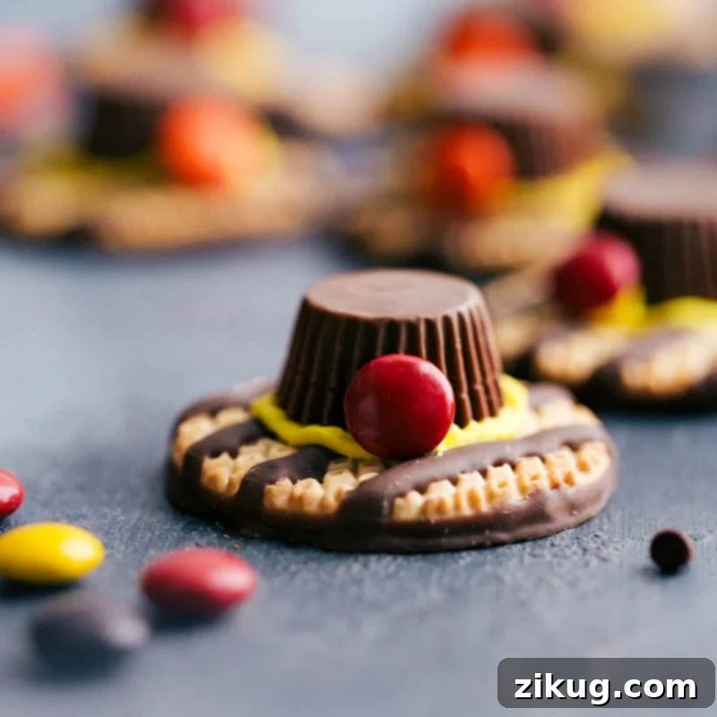 Whimsical pilgrim hats crafted from cookies and candy, serving as a creative and fun dessert idea for your Thanksgiving menu.