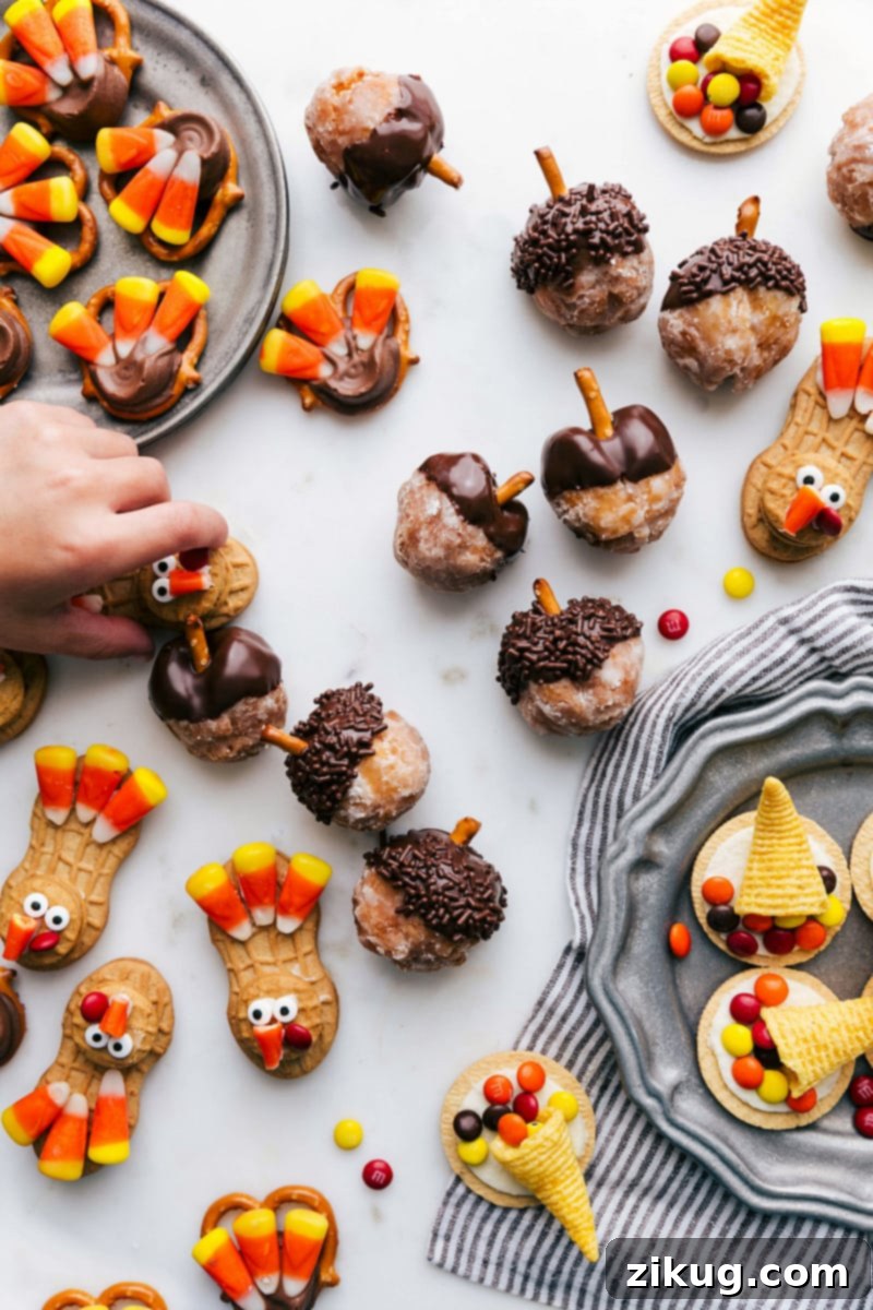 A Delicious Spread of Fall Treats Assortment of Fall Treats: Acorn Donut Holes, Turkey Nutter Butter Treats, Turkey Pretzel Rolo Treats, and Bugle Cornucopia.