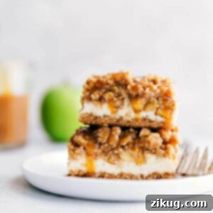 Cinnamon Apple Cheesecake Squares 3 A stack of caramel apple cheesecake bars with mouth-watering layers.