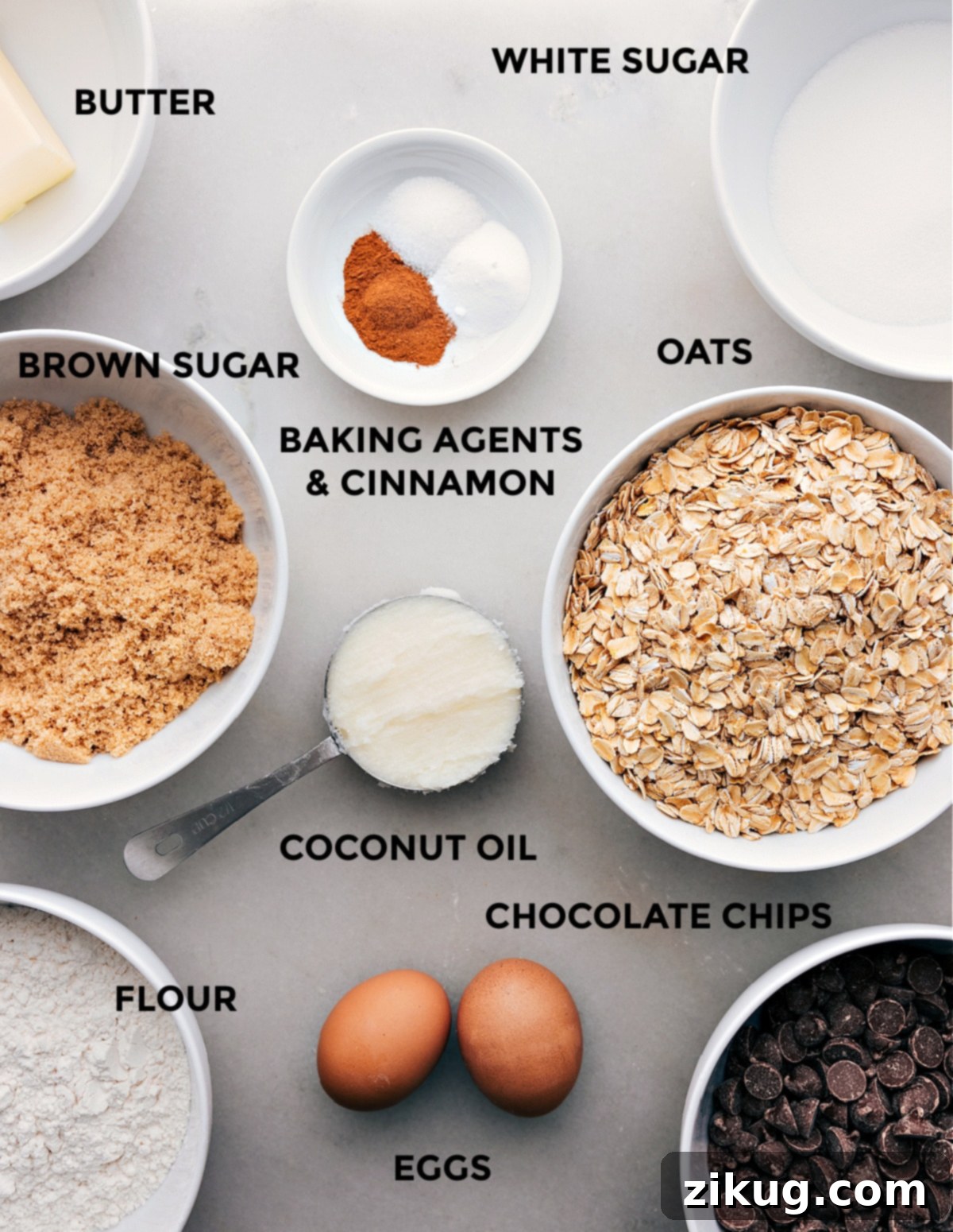 Key Ingredients for Perfect Coconut Oil Oatmeal Cookies A beautiful spread of all ingredients needed for Coconut Oil Oatmeal Cookies: oats, sugars, eggs, spices, and chocolate chips.