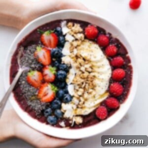 Ultimate Acai Bowl Bliss 2 A vibrant Acai Bowl in a ceramic bowl, topped with fresh berries, banana slices, and granola.
