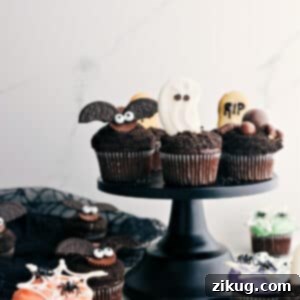 A beautifully decorated Halloween cupcake with intricate frosting and toppings.