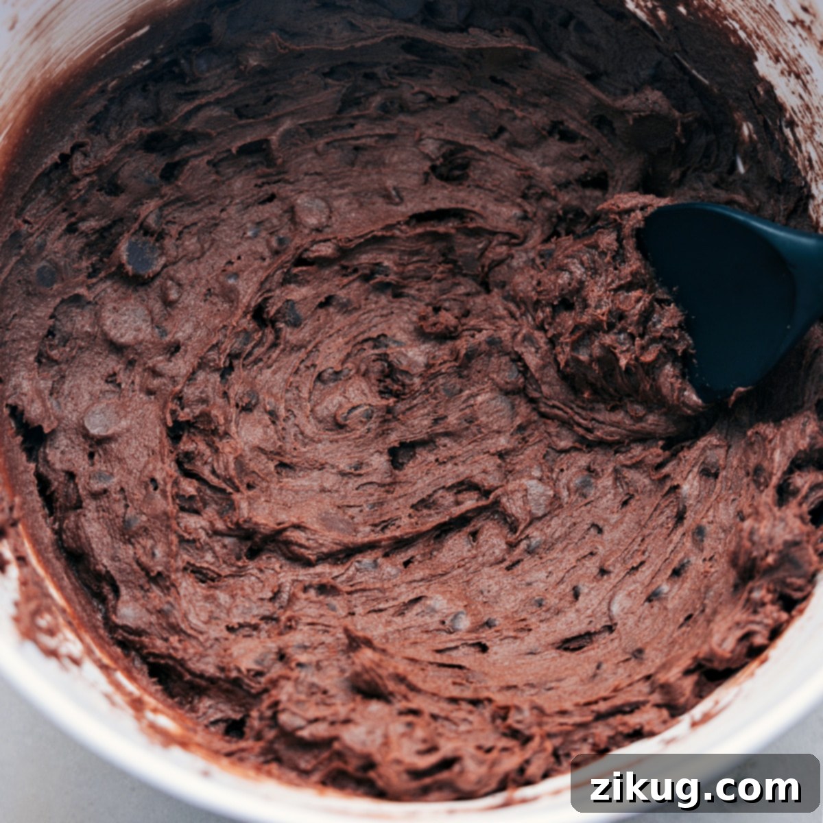 Preparing The Best Brownie Cookies Thick, chocolatey brownie cookie dough mixed in a bowl, ready to be formed into balls.