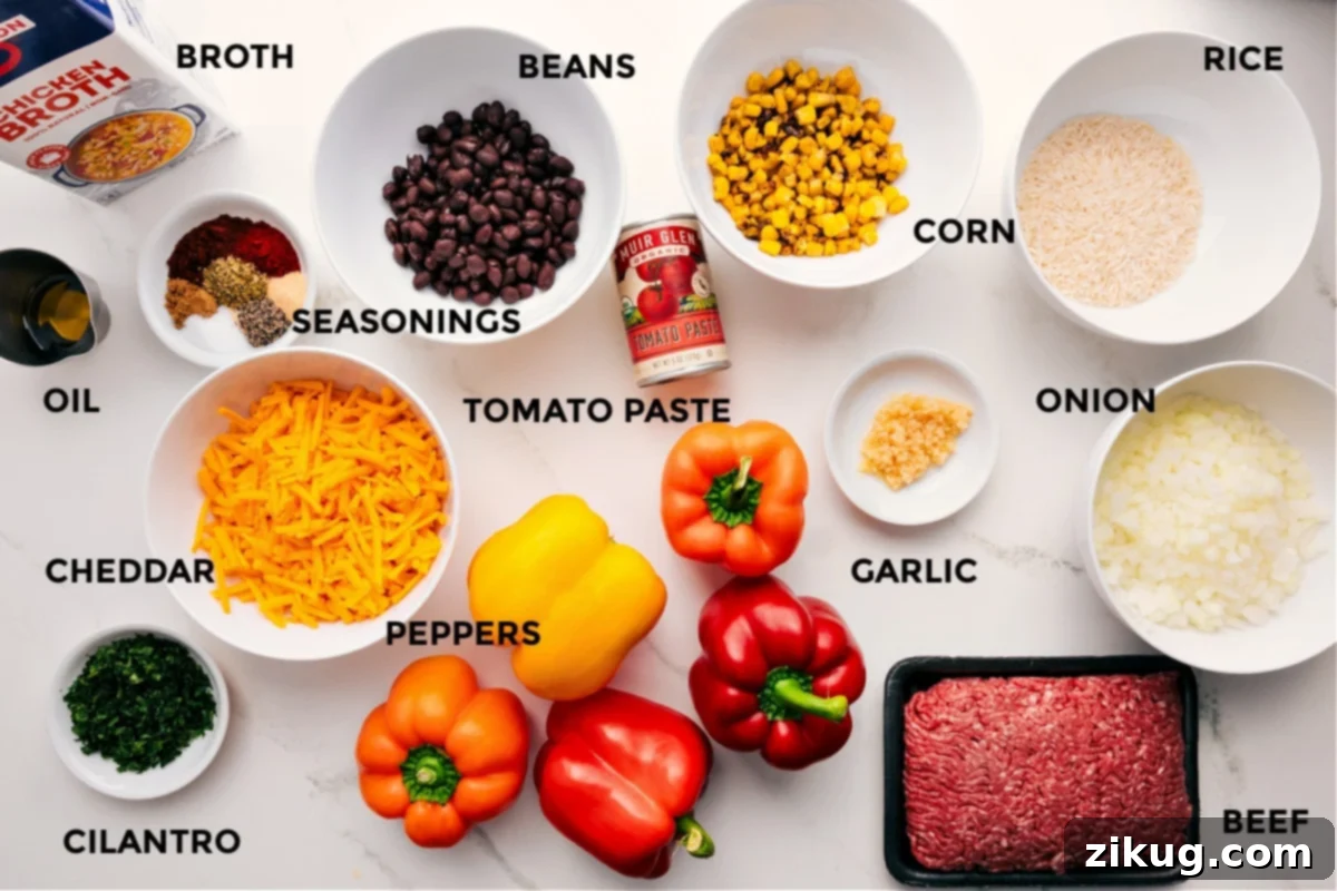 Essential Ingredients for Mexican Stuffed Peppers A vibrant display of fresh ingredients for Mexican stuffed peppers, including colorful bell peppers, lean ground beef, canned black beans, frozen corn, basmati rice, olive oil, diced onion, minced garlic, chicken broth, tomato paste, cilantro, and shredded cheddar cheese, all prepped and ready for cooking.