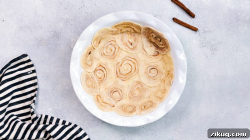 This innovative 'shortcut' apple pie uses store-bought crust transformed into a delicious cinnamon roll base. Process image demonstrating how to create the cinnamon roll crust from store-bought dough