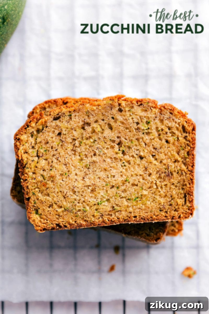 Delicious Zucchini Bread Recipe slices stacked on top of each other, showcasing a moist interior and golden crust, ready to be enjoyed with a cup of coffee.