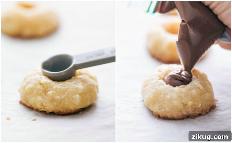 Filling warm coconut thumbprint cookies with creamy Nutella. Process shots: making an indentation and filling it with Nutella