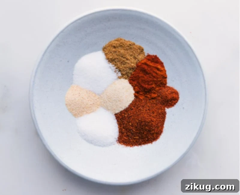 Sizzling Garden Fajitas 3 A bowl of homemade seasoning blend with measuring spoons.