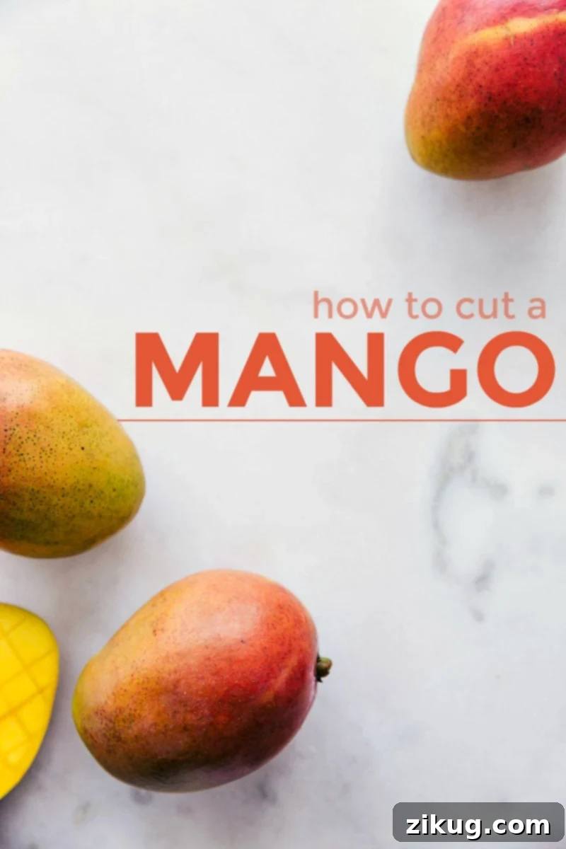 Step-by-step visual guide on how to cut a mango into cubes or strips, plus FAQs and recipe ideas. Close-up image of beautifully cut mango cubes and slices on a marble board, with the title "How to Cut a Mango" prominently displayed.