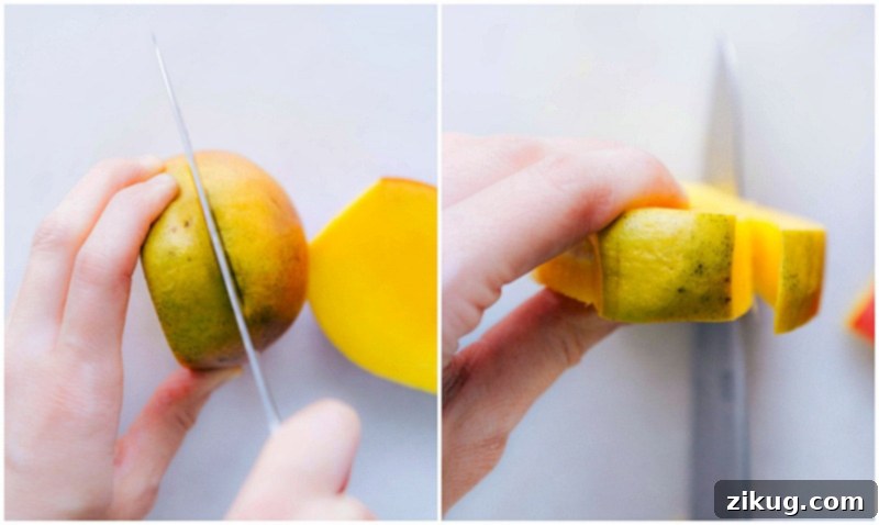 Visual guide on how to slice mango cheeks around the pit. Image demonstrating how to slice off the two wide sides of the mango, avoiding the pit.