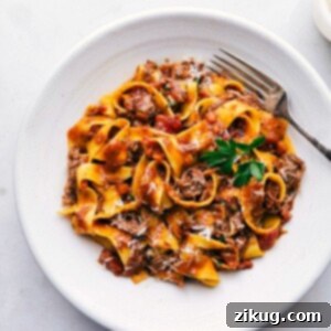 Tender Slow Cooker Beef Ragu 3 A bowl of slow cooker beef ragu with pappardelle pasta.