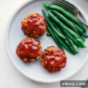 Homestyle Mini Turkey Loaves 3 Ready-to-eat mini turkey meatloaves next to green beans, plated beautifully.