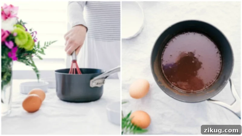 Tuxedo Crème Brûlée is a chocolatey twist on the traditional crème brûlée recipe. This dessert has a chocolate ganache bottom, creamy custard filling, and a caramelized sugar topping. Top these brulée with fresh berries and chocolate curls for a delicious show-stopping dessert. Recipe via ChelseasMessyApron.com #cremebrulee #tuxedo #ganache #French #dessert #elegant Image of the base chocolate layer of these Tuxedo Creme Brûlées being made.