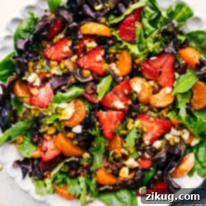 Beautifully plated Strawberry Salad with citrus dressing.