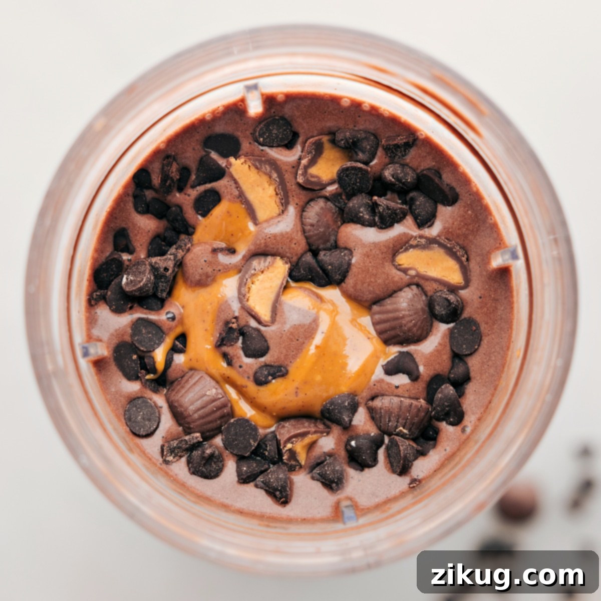 Chocolate Peanut Butter Protein Shake Mix-Ins Chocolate peanut butter protein shake with fun toppings like chocolate chips and reeses to give you a high protein treat.