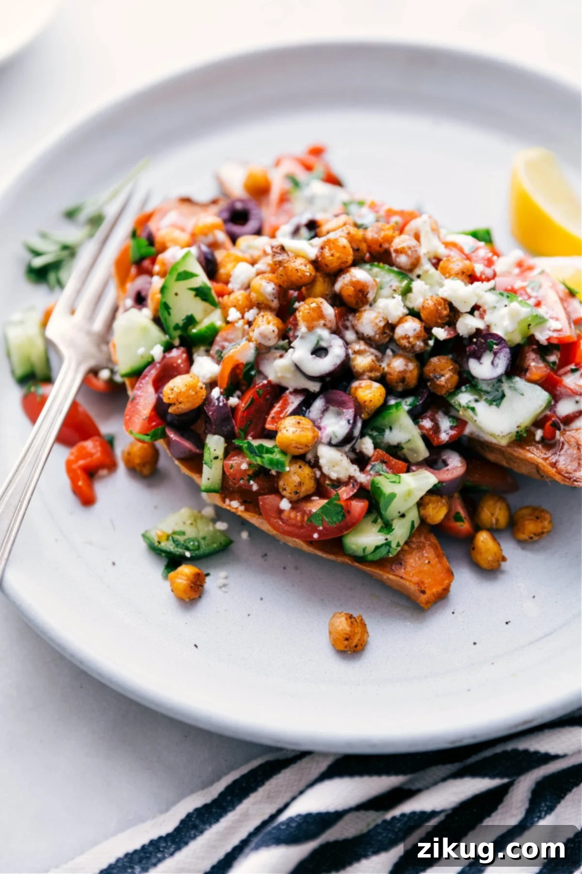 Mediterranean Baked Sweet Potatoes with Vibrant Vegetable Topping and Lemon Dressing