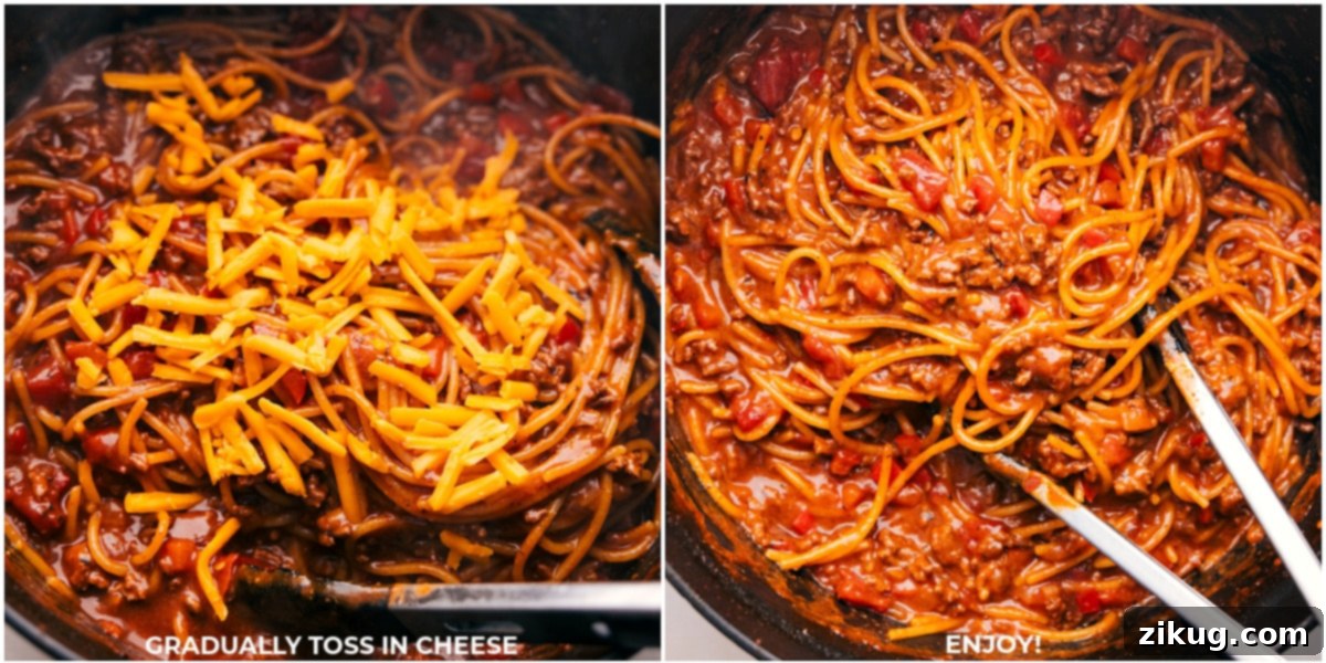 The Irresistible Cheesy Finish of One-Pot Taco Spaghetti A generous amount of creamy, freshly shredded extra sharp cheddar cheese being perfectly tossed and melted into the saucy ground beef and spaghetti noodles within a large pot, achieving the ultimate Cheesy Taco Spaghetti perfection.