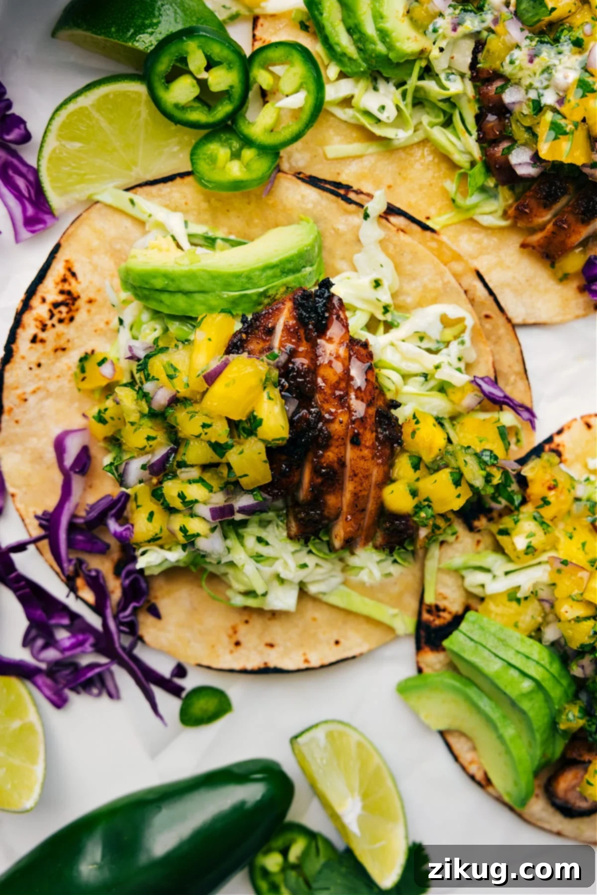 Island Jerk Chicken Tacos 2 Delicious Jerk Chicken Tacos with mango black bean salsa and a creamy sauce.