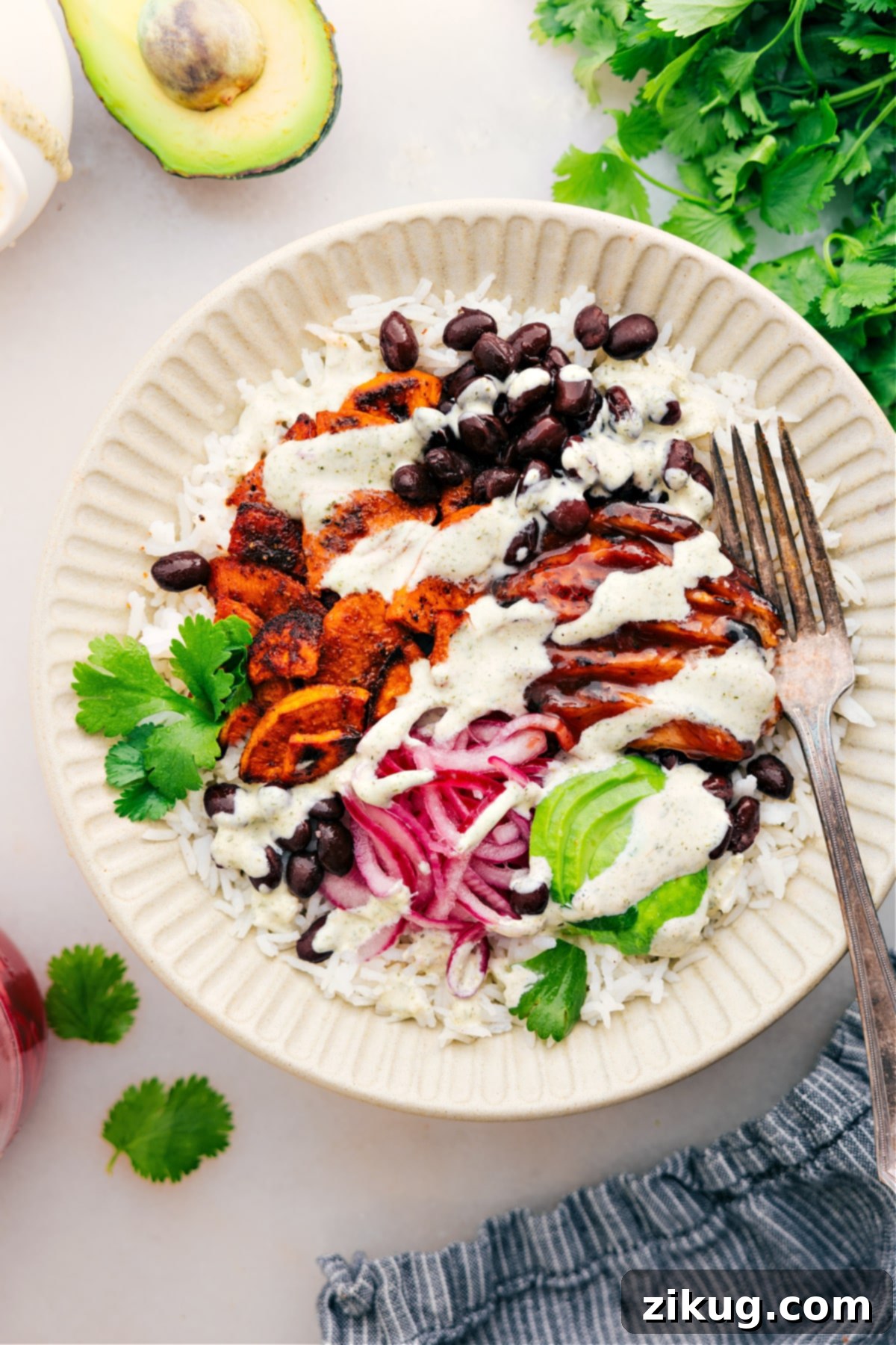 Easy and Delicious BBQ Chicken Rice Bowls for Quick Weeknight Dinners A perfectly assembled, easy, and delicious BBQ Chicken Rice Bowl, showcasing all its fresh and flavorful components layered beautifully and ready to be enjoyed.