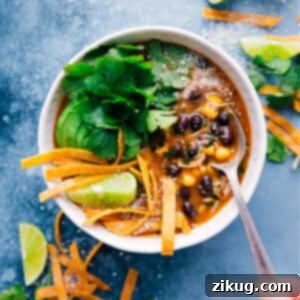 A bowl of vibrant Salsa Verde Chicken Soup, garnished with fresh toppings.