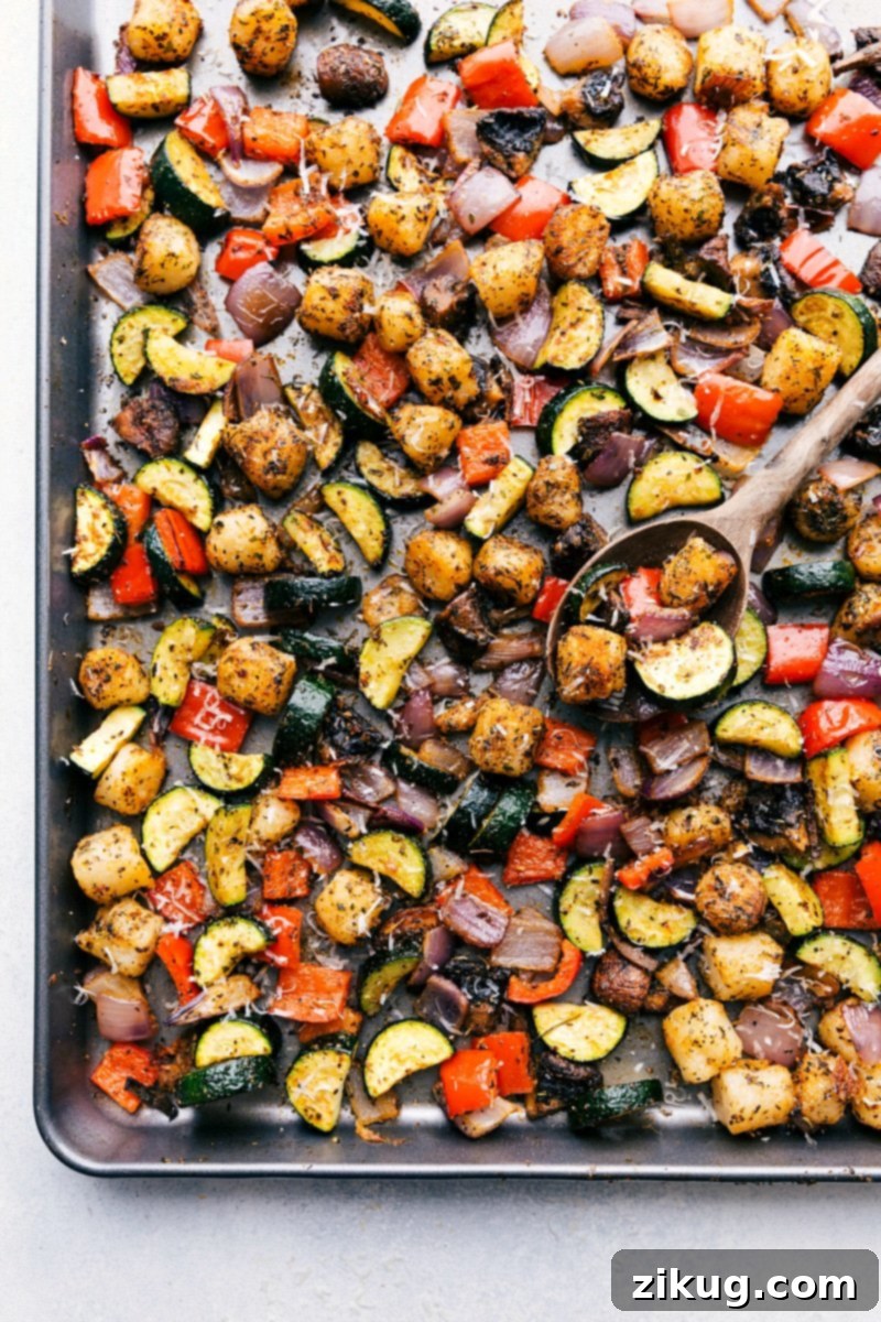 A perfectly cooked plate of baked gnocchi and roasted vegetables, ready to be served and enjoyed, showing off its golden-brown texture.