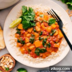 Close-up of a serving of Butternut Squash Curry over rice.