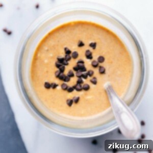 Pumpkin overnight oats topped with chocolate chips, prepared and ready for on-the-go enjoyment.