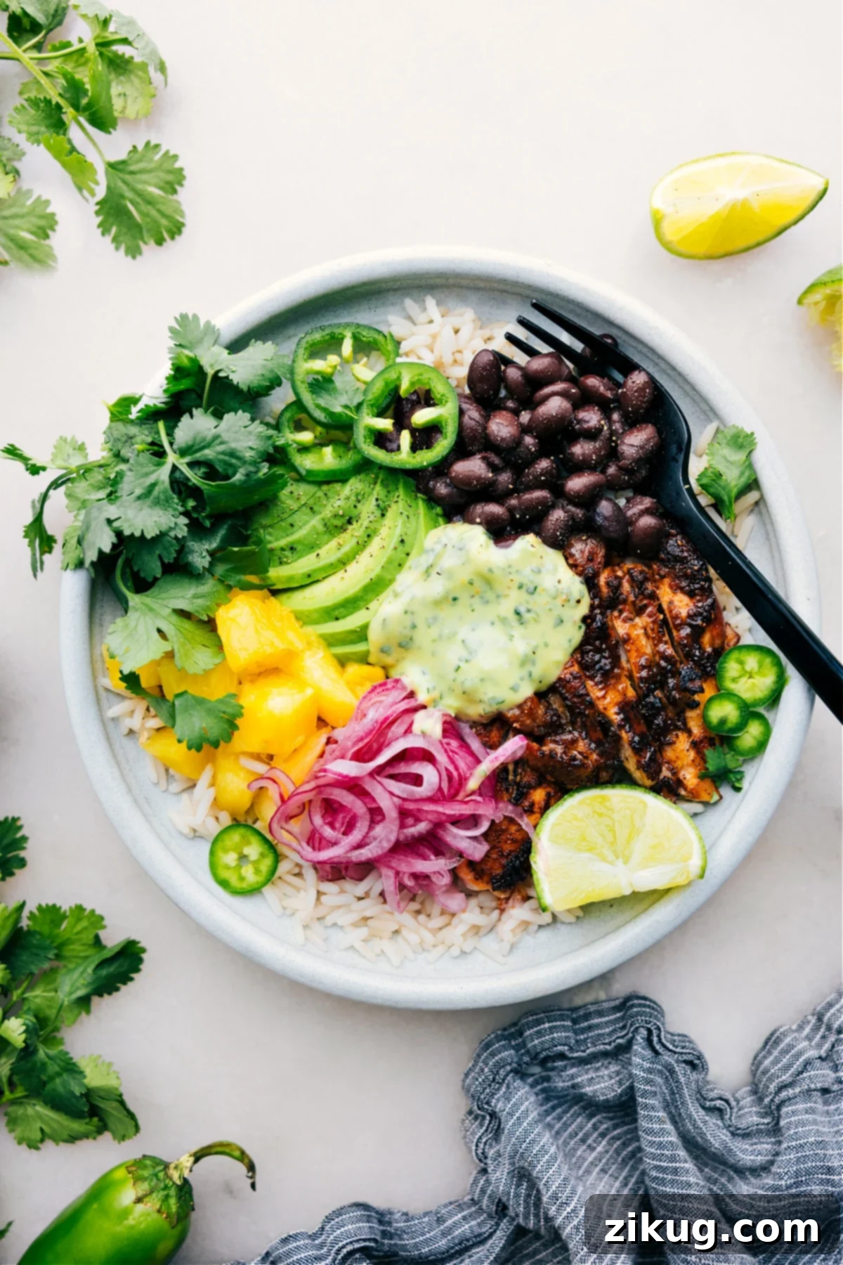 The Best Chicken Rice Bowl Recipe: Ultimate Flavor and Health A delicious Chicken Rice Bowl generously topped with juicy chicken, creamy avocado sauce, and fresh ingredients.