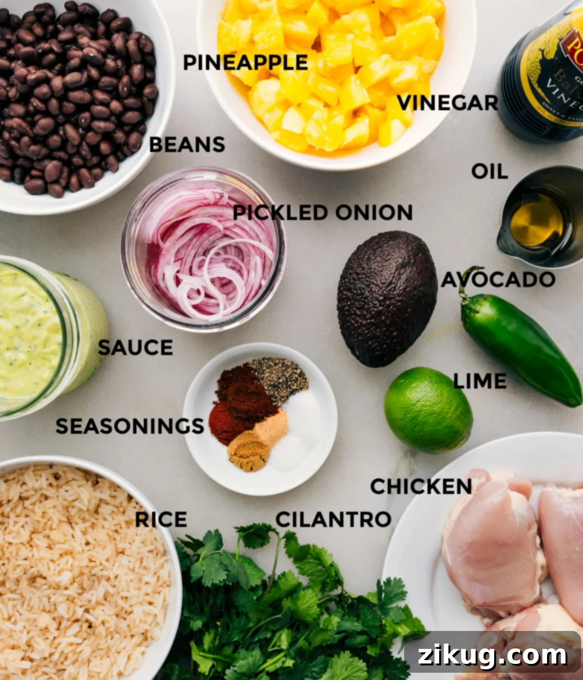 Key Ingredients for a Flavorful Chicken Rice Bowl All the fresh ingredients for the chicken and sauce prepped and laid out for easy assembly of the rice bowls.