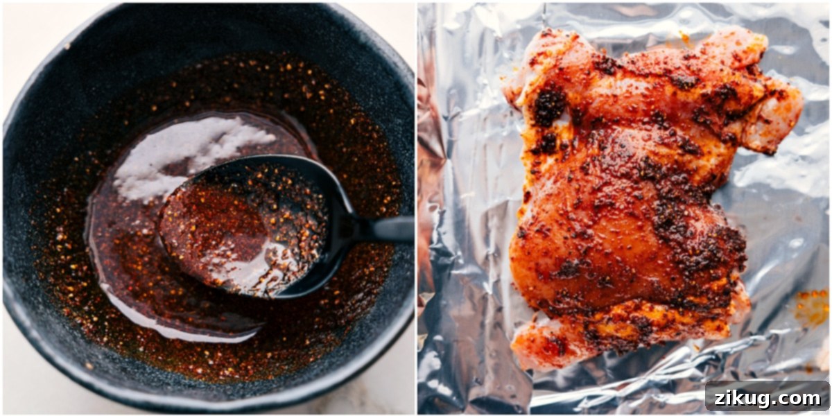 The Best Chicken Thigh Seasoning for Chicken Rice Bowls Applying the seasoning blend to chicken thighs, creating a flavorful marinade for the ultimate chicken rice bowl.