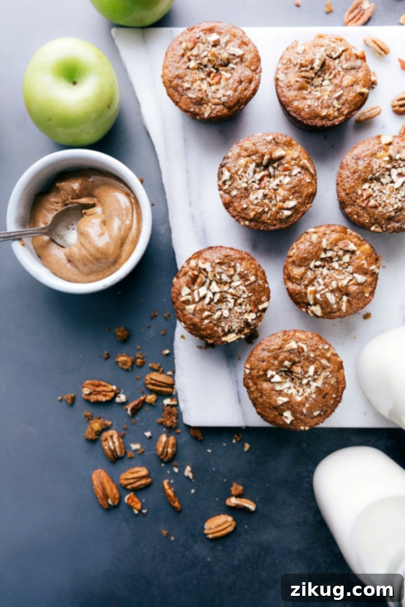Wholesome Homemade Gluten-Free Apple Muffins, Warm and Ready Freshly baked gluten free apple muffins cooling on a rack, inviting to be enjoyed.