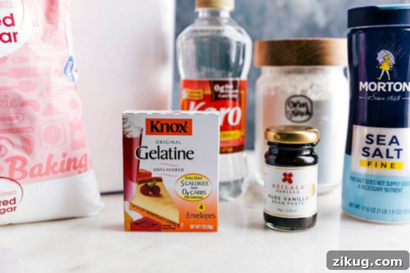 Essential Ingredients for Fluffy Homemade Marshmallows Ingredients laid out for the homemade marshmallow recipe, showcasing the simple yet essential components like granulated sugar, light corn syrup, and unflavored gelatin.